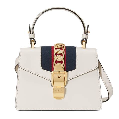 gucci くつした|white Gucci bag.